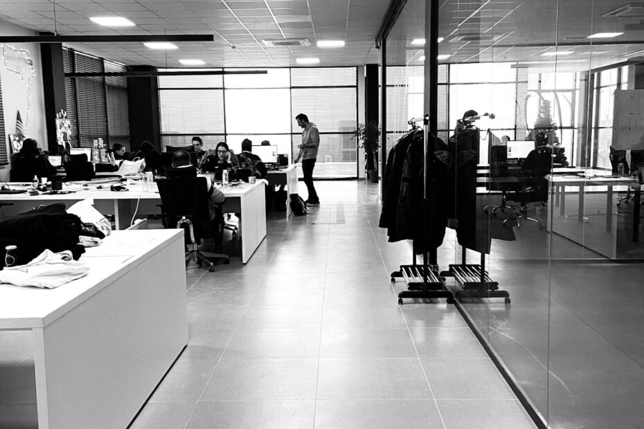 Black and white image of a workplace.a